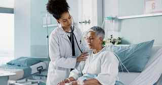 A doctor treats a patient. What bra should you wear after lung surgery? Learn everything you need to know in our comprehensive guide.