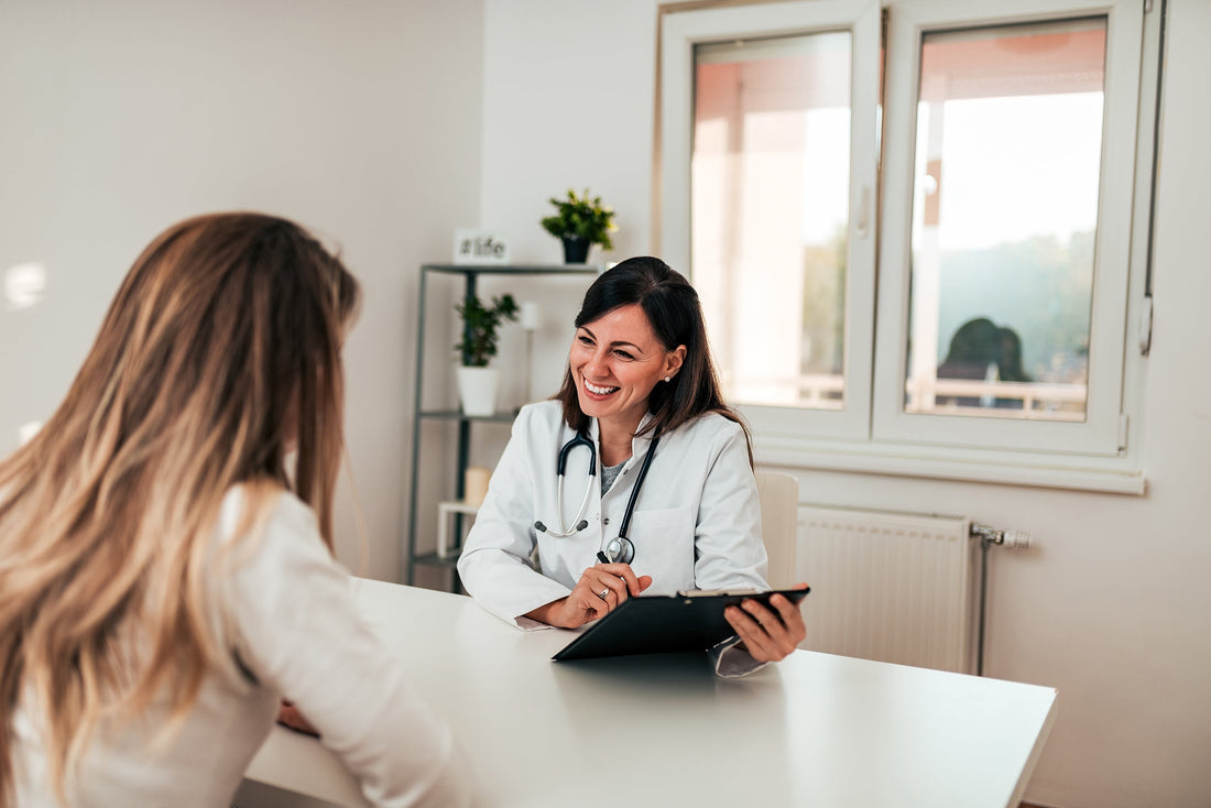 Woman talks to her doctor. Post-surgical bras may be covered by insurance under code L8015. Learn how billing works across Medicare, Medicaid, and private plans.
